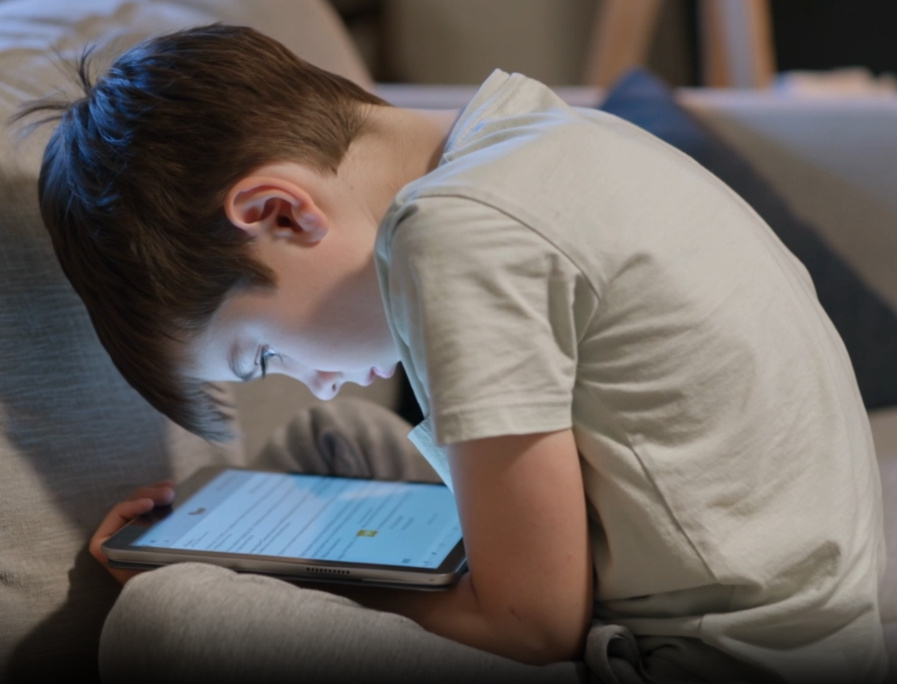 Kid slouching on device